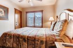 Plush bedding within a one bedroom in River Run Village
